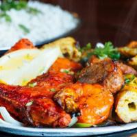 Tandoori Mixed Grill · A combination of our appetizing tandoori chicken, seekh kabab, shrimp tandoori, lamb chop, c...
