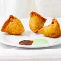 Meat Samosa (2 Pieces) · Crispy fried turnovers filled with ground lamb.