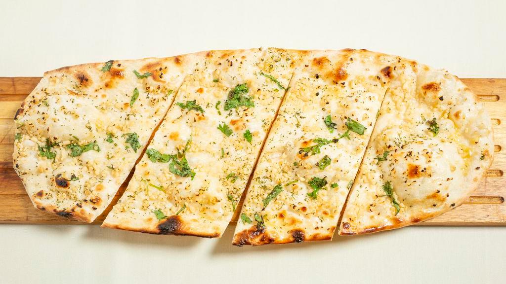 Garlic Naan · Healthy unleavened bread stuffed with fresh garlic.