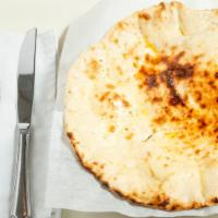Naan · Traditional white bread, baked in the tandoor.