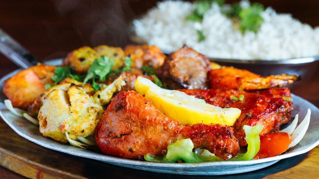 Tandoori Mixed Grill · A combination of our appetizing tandoori chicken, seekh kabab, shrimp tandoori, boti kabab, malai kabab and chicken tikka.