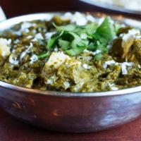 Palak Paneer · Fresh, homemade Indian cheese gently cooked with garden spinach and mild spices.