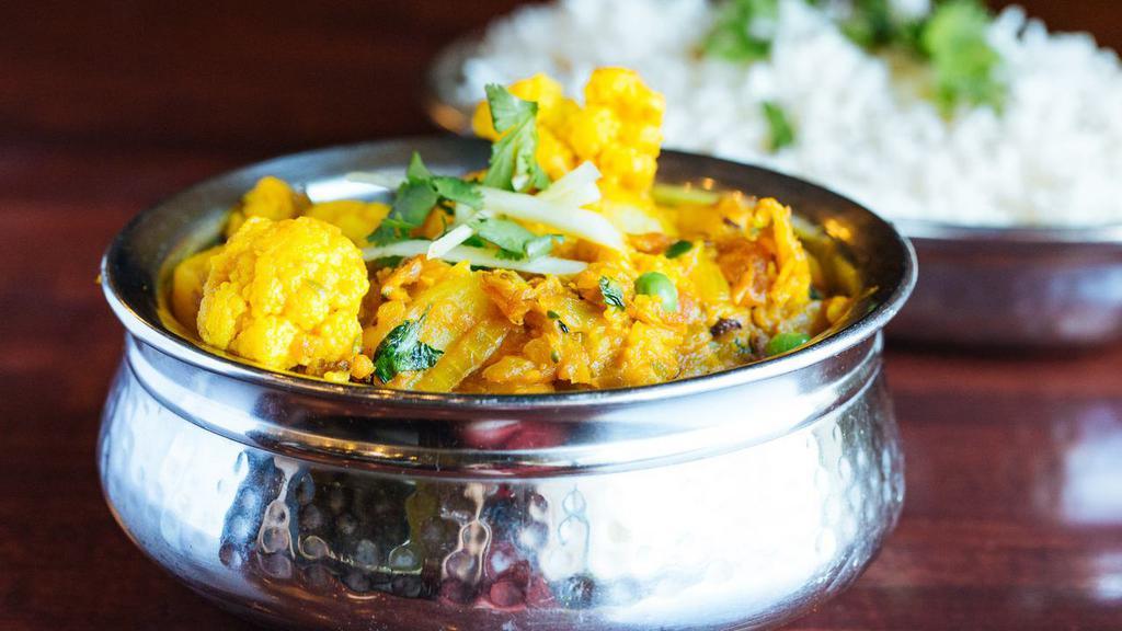 Aloo Gobhi · Fresh cauliflower and potatoes, cooked with onions, tomatoes and Indian seasonings.