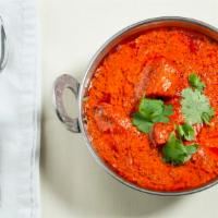 Chicken Tikka Masala · Tender boneless pieces of chicken broiled in the tandoor then cooked in a rich tomato, onion...