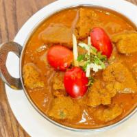 Lamb Rogan Josh · Tender cubes of lamb marinated in Eastern spices, sautéed with chopped tomatoes in a creamy ...