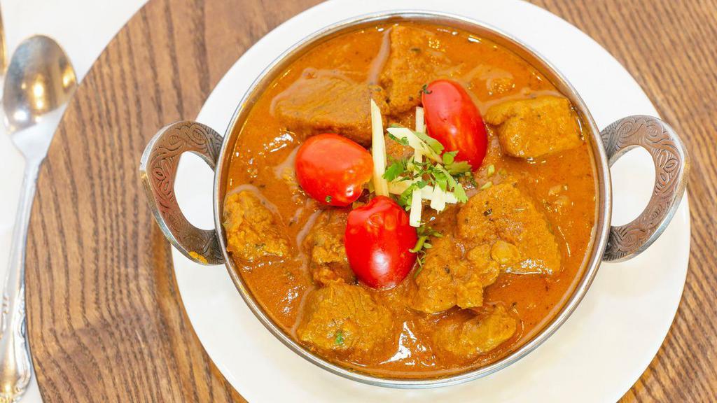 Lamb Rogan Josh · Tender cubes of lamb marinated in Eastern spices, sautéed with chopped tomatoes in a creamy sauce.