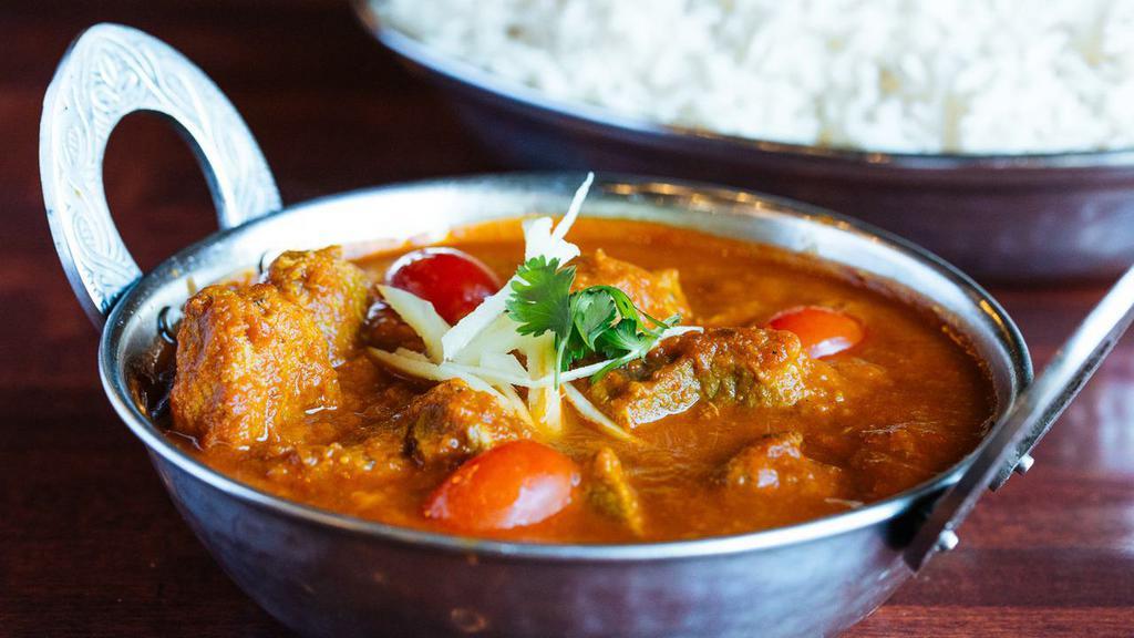 Lamb Vindaloo · Spiced lamb cooked in a very spicy sauce.