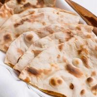 R1 Tandoori Roti · Whole Wheat Bread Indian Style cooked in clay oven