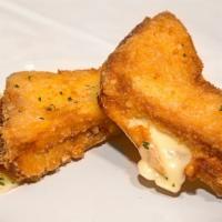 Mozzarella En Corrozza · Fried mozzarella sandwiches with marinara sauce.