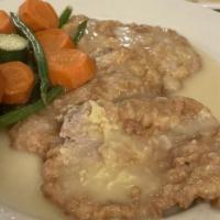 Chicken Francese · Breast of chicken in a light egg batter with white wine and lemon.