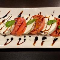 Caprese Salad · Fresh mozzarella, tomato and fresh basil with a drizzled balsamic reduction.