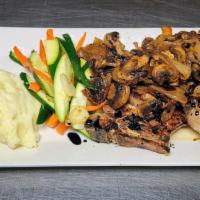 Twin Center Cut Pork Chops · Topped with sautéed onions and mushrooms. Served with sautéed seasonal vegetables and mashed...
