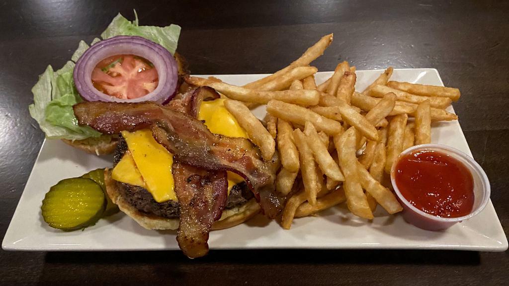 Rtr&G Burger · A perfect blend of short ribs, chuck and ribeye topped with smokehouse bacon, lettuce, tomatoes, onions, pickles and your choice of melted cheese served on a toasted brioche bun.
