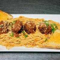 Linguini With Meatballs · Meatballs covered in marinara sauce and and parmesan cheese over a bed of linguini served wi...