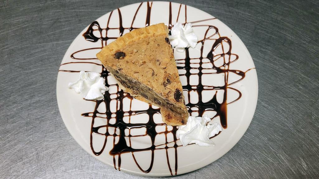 Toll House Cookie Pie · Cookie crust with chocolate chip cookie dough, walnuts, and brown sugar.