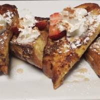 French Toast · Thick slices of challah custard dipped and covered in cinnamon, sugar, maple syrup and whipp...