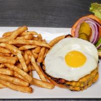 Brunch Burger · A perfect blend of short ribs, chuck and ribeye topped with smoke house bacon, a fried egg, ...