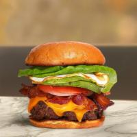 Breakky Break Burger · American beef patty topped with bacon, fried egg, avocado, melted cheese, lettuce, tomato, o...