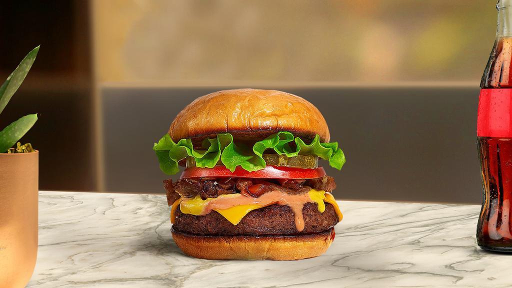 Classic True Burger · American beef patty topped with lettuce, tomato, and mayo. Served on a warm bun.