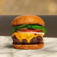 Cheesy Mood Burger · American beef patty topped with American cheese, lettuce, tomato and mayo. Served on a warm ...