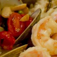Shrimp & Long Island Clams · Sautéed with garlic, grape tomatoes, and white wine with Spanish risotto.