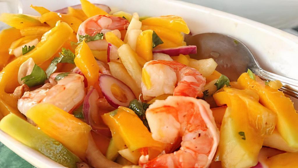 Mango Shrimp · Shredded mango with sweet peas, green & red peppers cooked in spicy mango sauce.