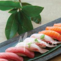 Tri Color Sushi · 3pcs yellowtail / 3pcs salmon / 3pcs tuna / tuna roll.