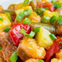 Pineapple Chicken · Lightly fried white meat chicken with pineapple, green & red peppers and sweet peas in our c...
