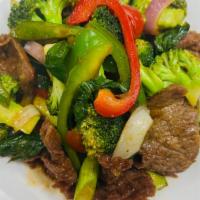 Basil Beef · Basil leaf, onions, broccoli, asparagus, scallions, green & red bell peppers in chef’s speci...