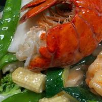 Sea Treasure · Combination of prawns, scallops, squid and lobster tail with mixed vegetables in special whi...