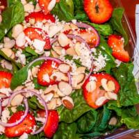 Strawberry Spinach Salad · Spinach, fresh strawberries, almonds, feta cheese, balsamic dressing