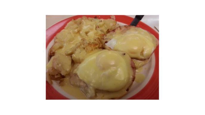 Eggs Benedict · Two Poached Eggs, Served Over an English Muffin, with Canadian Bacon, Topped with Hollandaise Sauce.