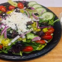 Greek Salad · Feta cheese, cucumbers, cherry tomatoes, red onions and kalamata olives over greens.
