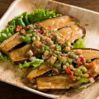Grilled Miso Eggplant · Garnish with mushrooms, onions, and bell peppers.