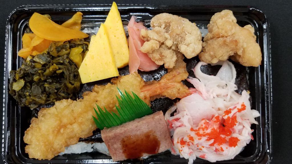 Sushiman Bento A · Shrimp tempura, Karaage, Egg, Crab, Spam, Pickles.