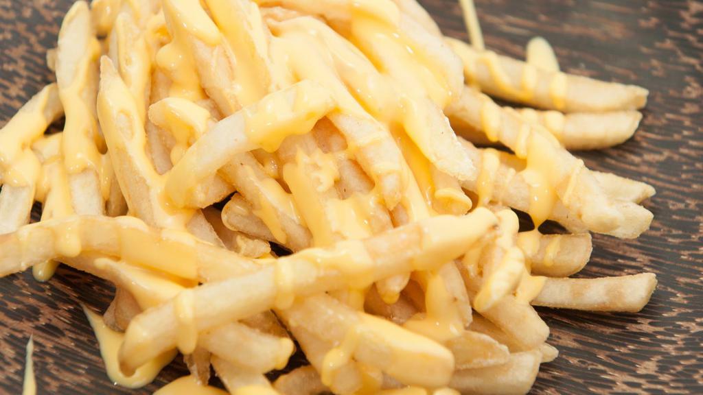 Cheese Fries · Fresh homemade French fries covered with melted cheese.