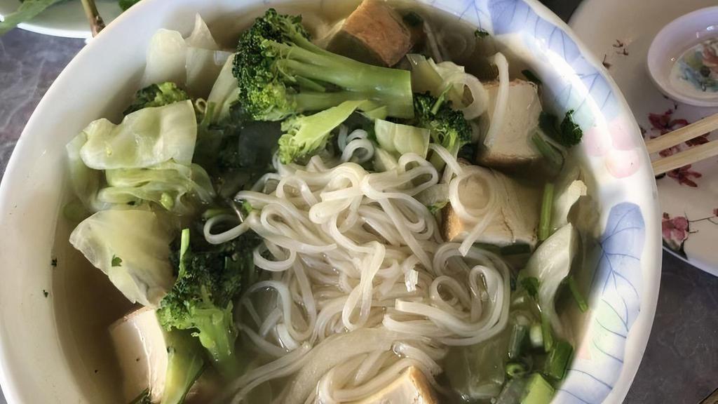 Vegetarian Pho / Phở Rau · Choice of Cuu Long 2 Signature beef broth, or mushroom base Vegan broth. Tofu, Cabbage, Broccoli, carrots over rice noodles. Cilantro, green onion, white onion in the soup.