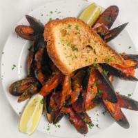 Cozze · Sauteed PEI mussels with white wine or spicy tomato sauce with garlic toasted bread