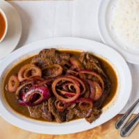 Bistec Encebollado Selleccionada · Most popular. Steak with onions. Served with rice and beans or fried green banana or special...