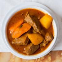Carne Guisada Selleccionada · Beef stew. Served with rice and beans or fried green banana or specialty rice.