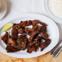 Carne Frita De Cerdo Selleccionada · Pork meat. Served with rice and beans or fried green banana or specialty rice.