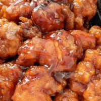 Orange Chicken · Hot and spicy. Chunks of chicken sauteed in special brown sauce and sesame seed.