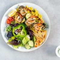 Shrimp Kabobs · Two shrimp kabobs with zucchini marinated in dill and garlic.