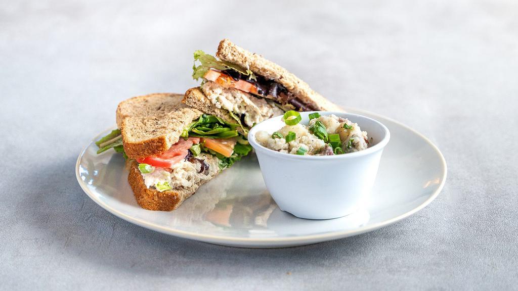 Chicken Salad Sandwich · All white-meat chicken salad with spring mix and tomatoes on multigrain bread. Comes with Deep River Original Chips and choice of apple slices or orange slices.