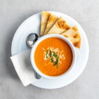 Tomato Bisque - Bowl · Tomatoes with garlic and onion. Perfect for pairing or on its own. Served with pita.