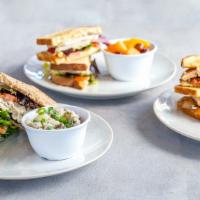 Pick Two · Choose between a half sandwich, bowl of soup, or side Greek salad.