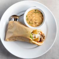 Steak Pita  · Grilled steak wrapped in a pita with Spicy Aioli, caramelized onions, feta, spring mix, and ...