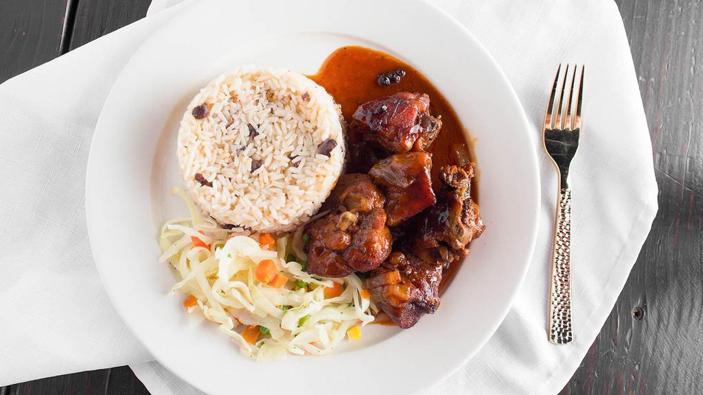 Stewed Chicken · Authentic jamaican brown stew chicken that is deeply flavored intensely aromatic and straight classic island vibes topped with mangoville brown stew sauce.
