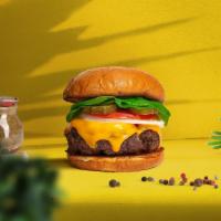 Vegan Cheese Burger Deluxe · Seasoned plant-based patty topped with melted vegan cheese, lettuce, tomato, onion, and pick...