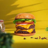 Vegan Cheese Double Burger · Two seasoned plant-based patties topped with melted vegan cheese, lettuce, tomato, onion, an...
